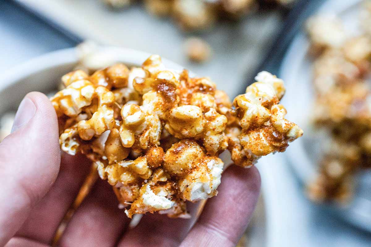 Easy Caramel popcorn with peanuts start to shape the popcorn