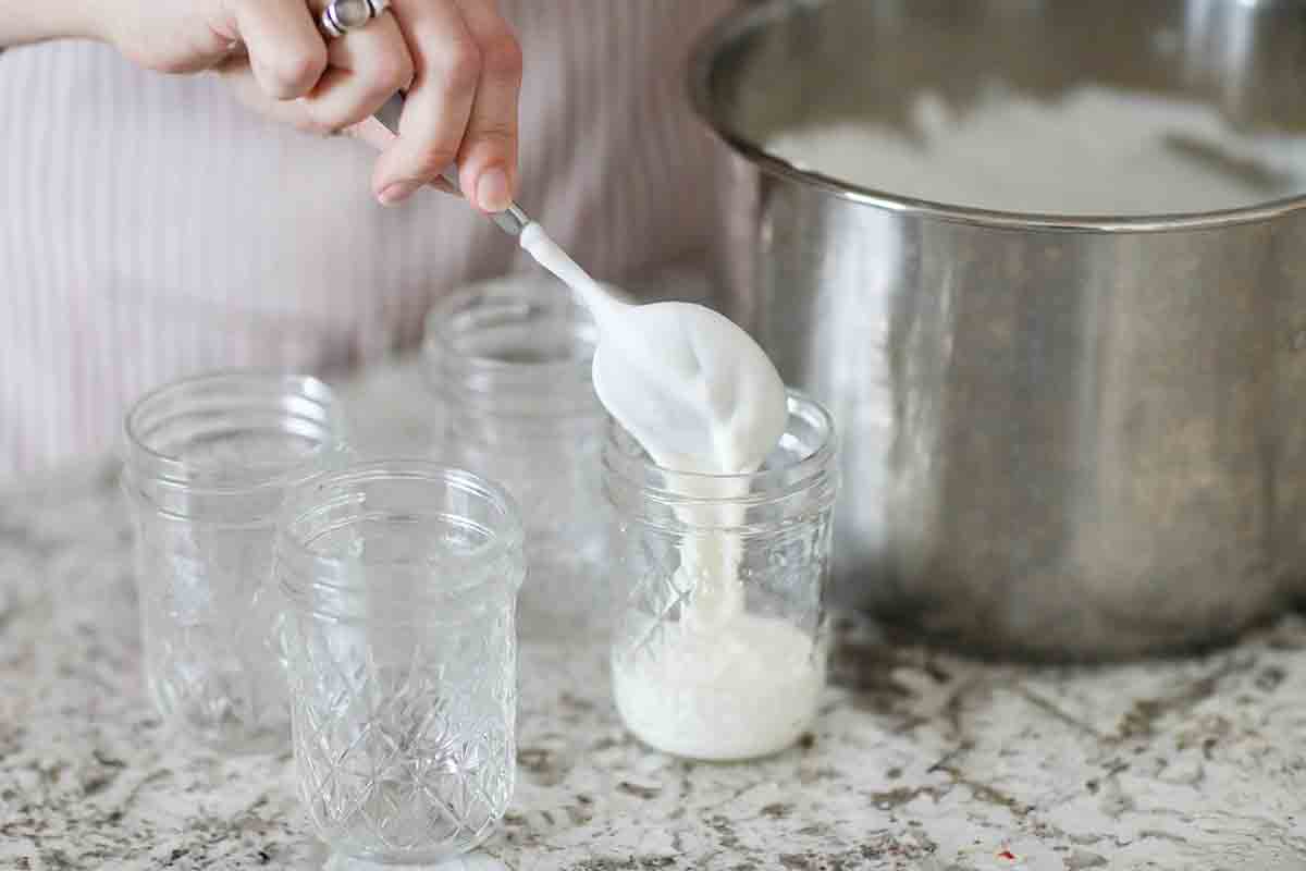 Homemade Yogurt in the Instant Pot transfer the yogurt to jars