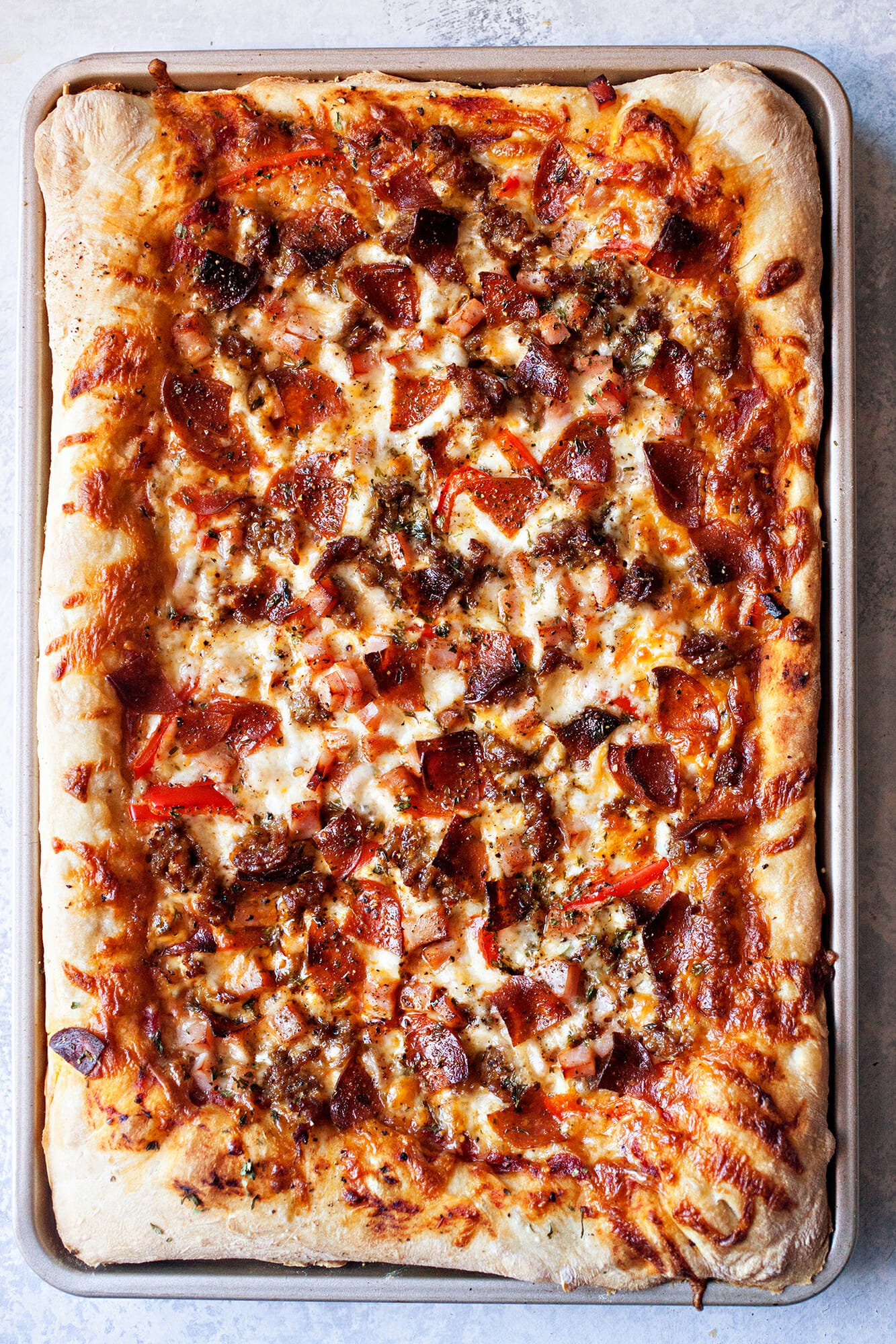 https://millersfoodmarket.com/wp-content/uploads/2019/01/MEatlovers-Sheet-Pan-Pizza-baked_HERO_verical-3.jpg