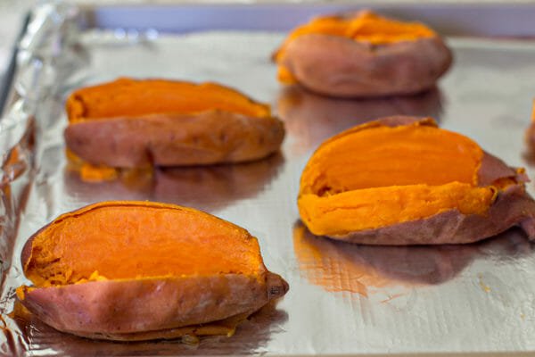 Pressure Cooker Sweet Potatoes with BBQ Chicken split the potatoes open