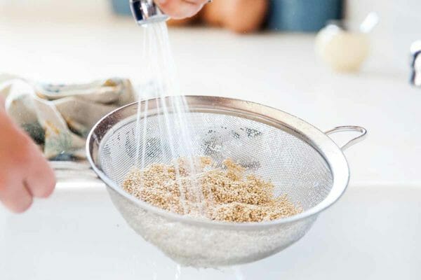 What to put in a quinoa bowl - rinse quinoa under running water