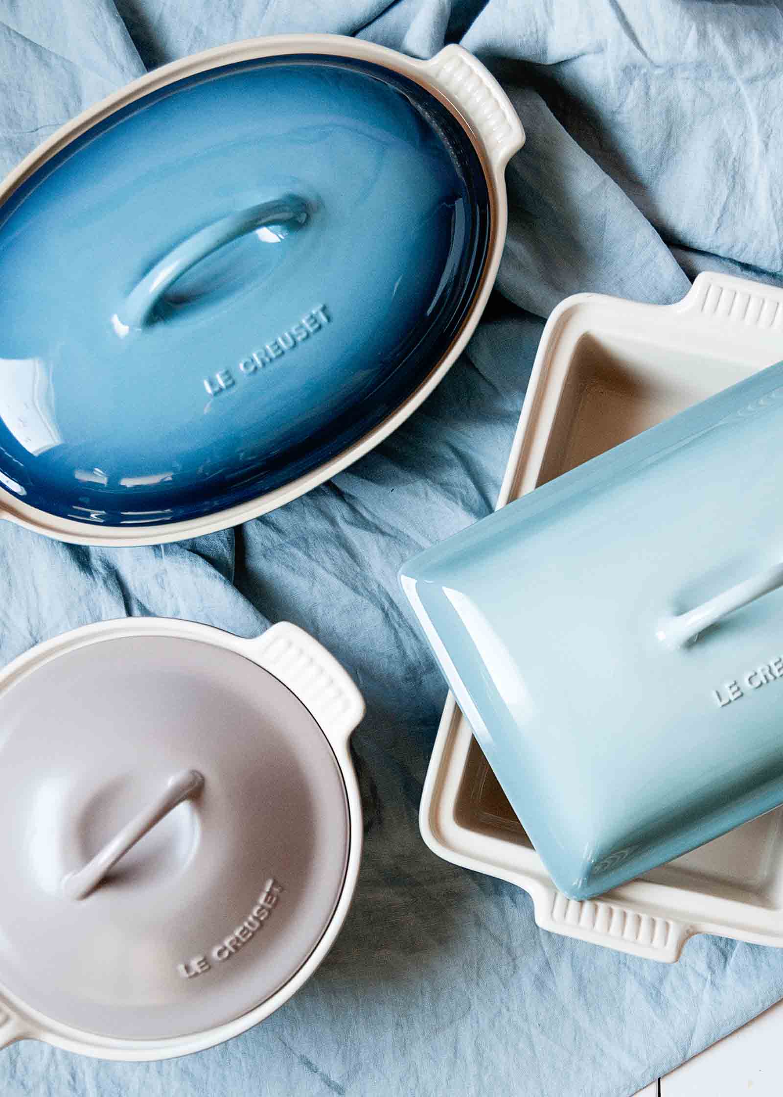 Overhead shot of stoneware dishes with lids