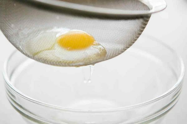 drain thin egg whites through fine mesh sieve