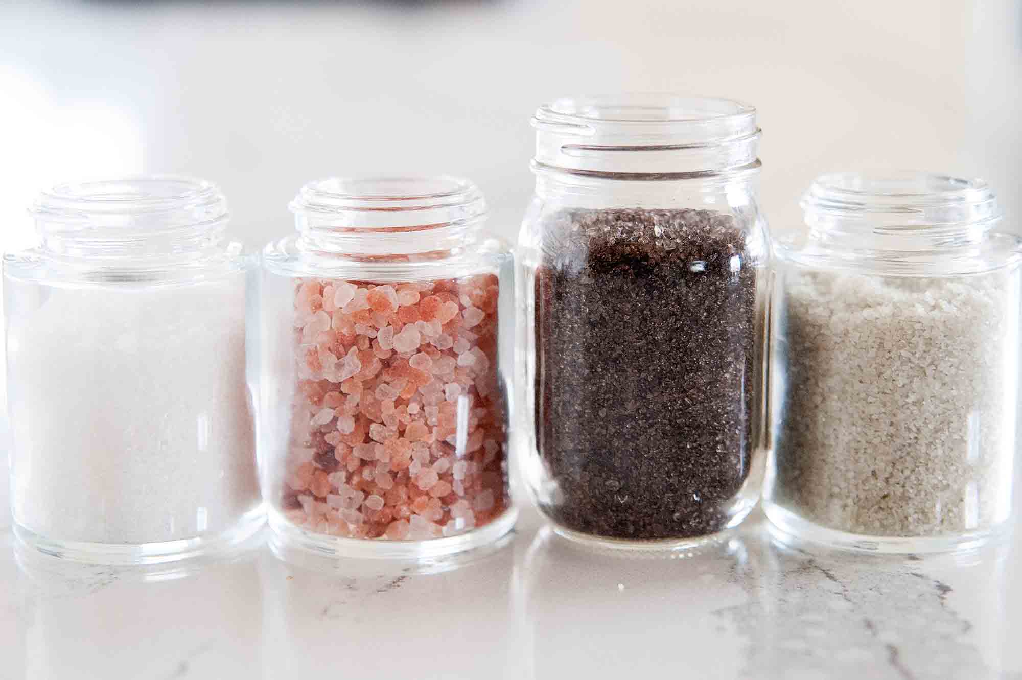 Jars of salt sel de gris, smoked salt, pink himalyan sea salt and white flaky sea salt