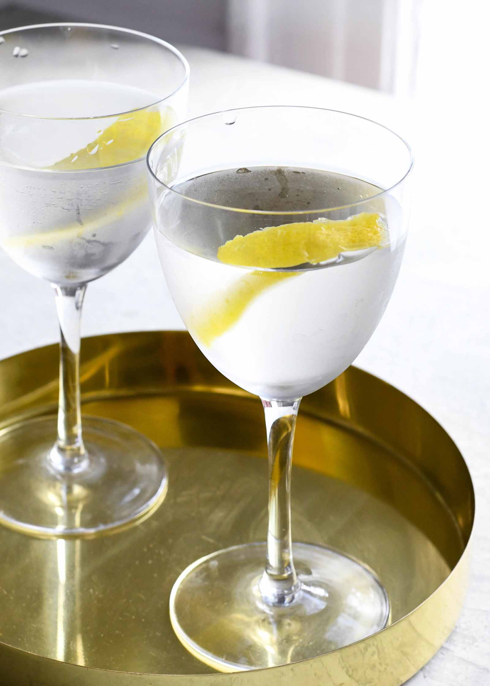 Dry Martini Recipe vodka martini in glass with lemon peel garnish