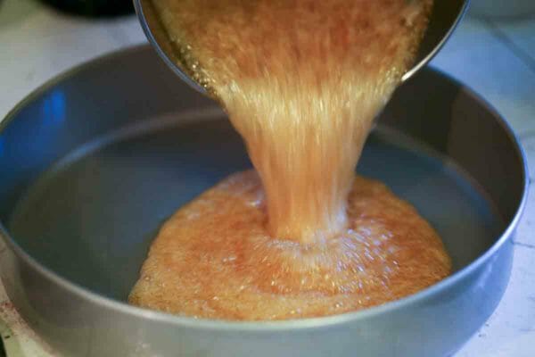 Pineapple Upside Down Cake from Scratch - Pouring the caramel into the pan