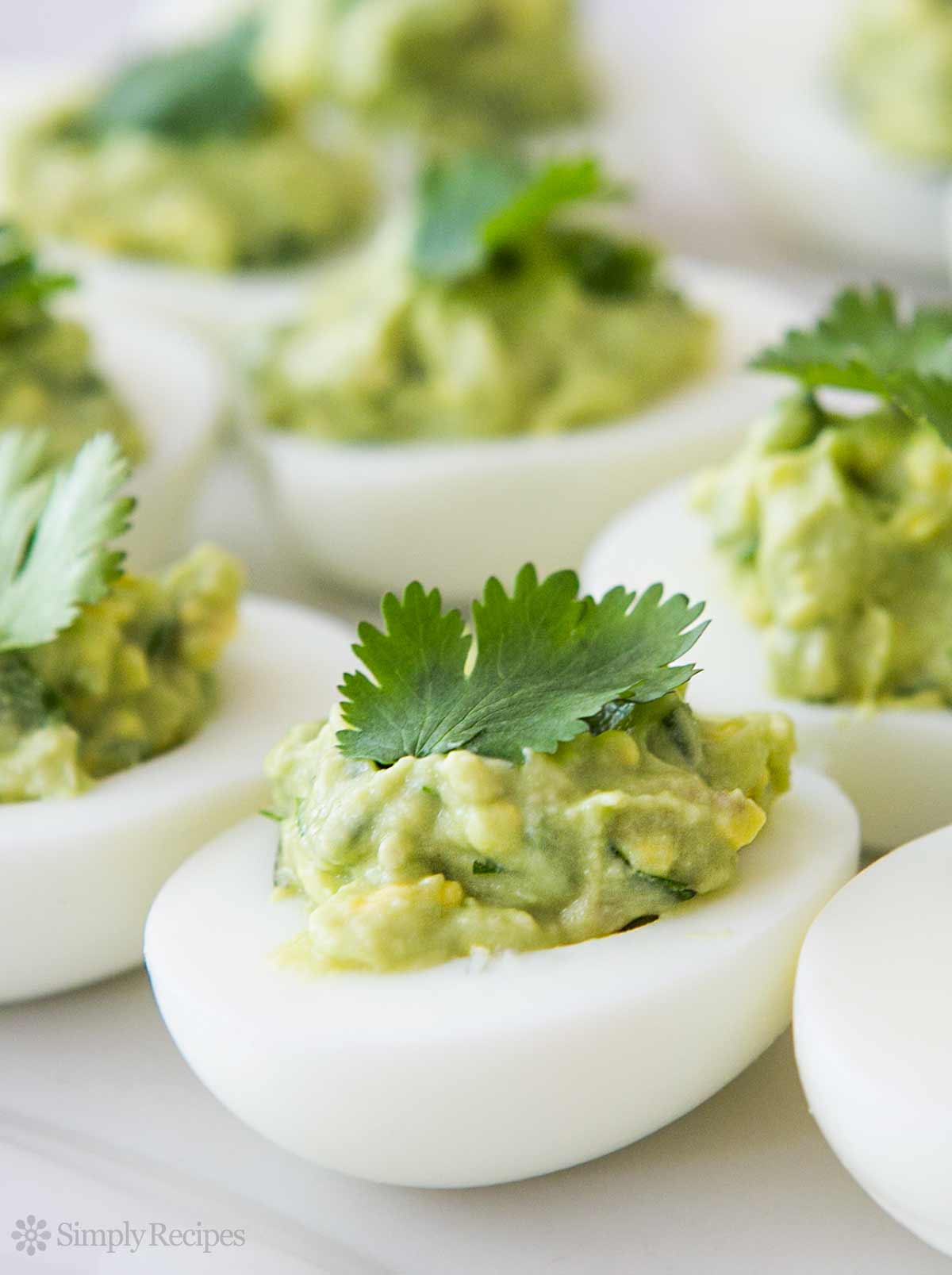 https://millersfoodmarket.com/wp-content/uploads/2019/07/guacamole-deviled-eggs-vertical-a-1200-1.jpg