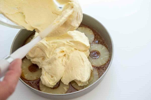 Pour Cake batter over pineapple and caramel