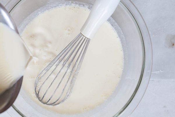 Whisk the warm cream mixture into the milk and gelatin mixture for the panna cotta recipe