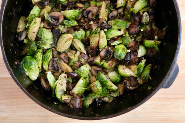 Brussels Sprouts and mushrooms cooked in a skillet to make Vegetable Breakfast Casserole.