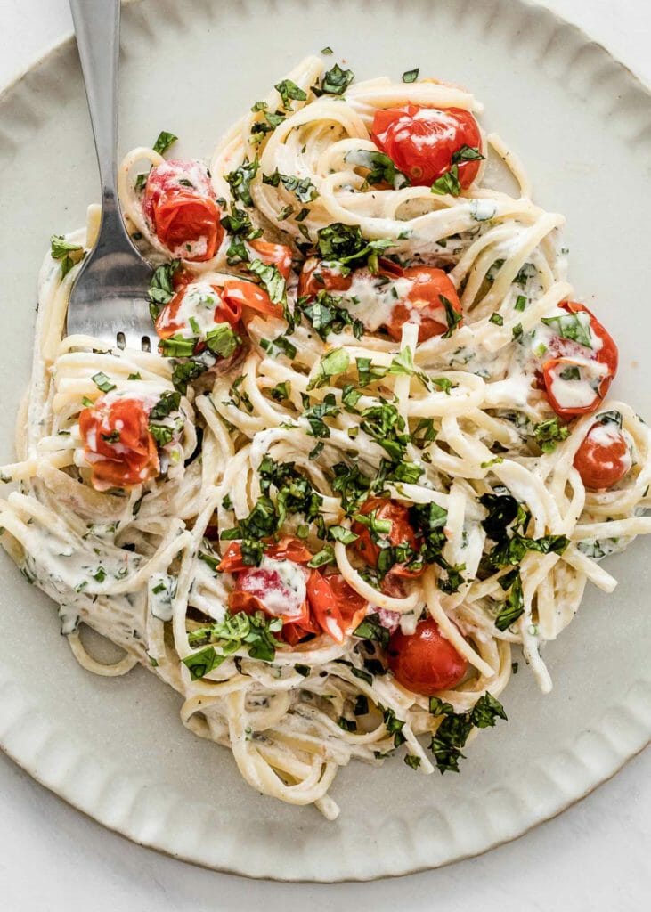Vegan pasta with cashew sauce and tomatoes